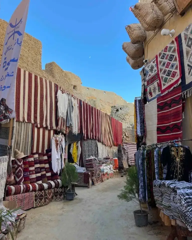 Street market beneath the ancient walls of the Shali Fortress