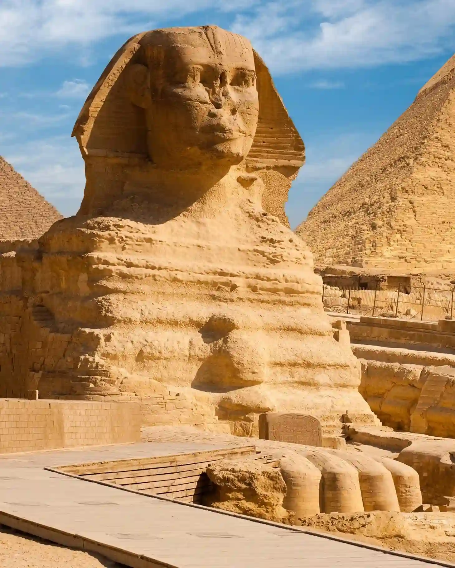 The Great Sphinx of Giza stands proudly in front the pyramid