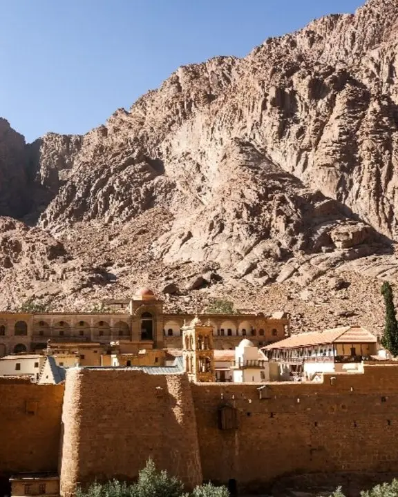 The fortified stone walls and buildings of Saint Catherine's Monastery nestle