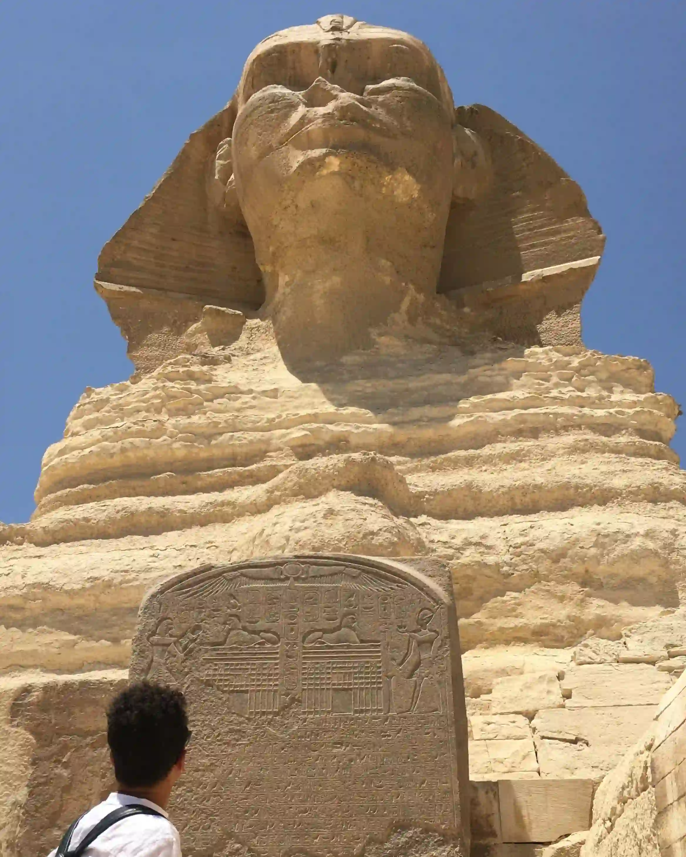 Between the massive paws of the Great Sphinx of Giza