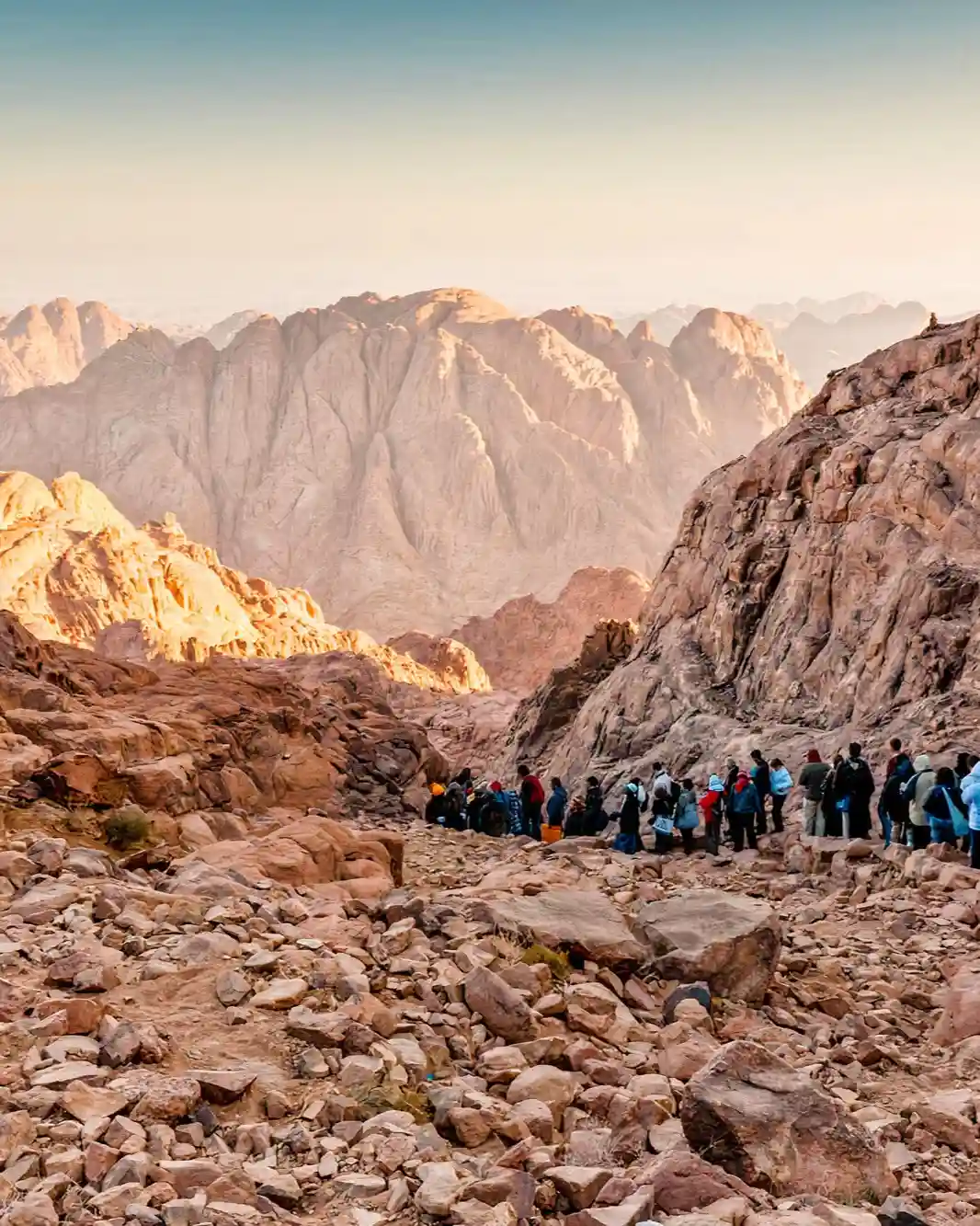 Group of hikers with the rugged peaks of Mount Sinai